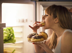 Young woman having a midnight snack