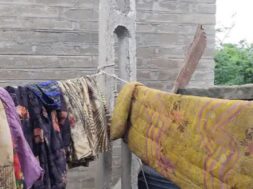 CLOTHES DRYING ON IRON WIRE